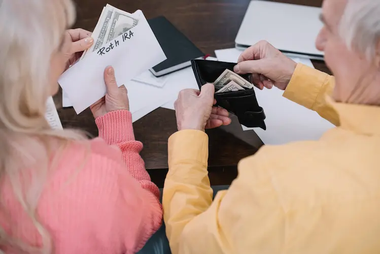 an older couple counting money