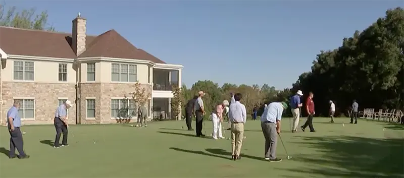 a group practicing golf outside of Waverly Heights retirement community