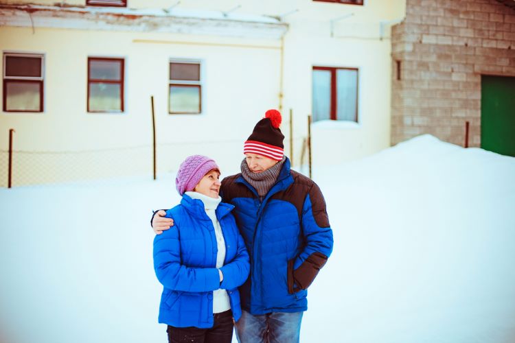 a couple outside in the snow